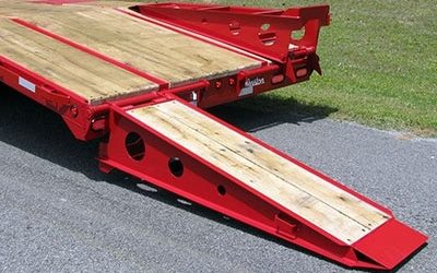 A Wooden Bench Sitting In The Grass