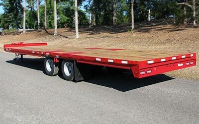 A Truck That Is Driving Down The Road