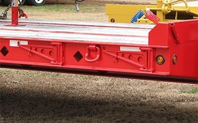 A Small Truck Parked On The Grass